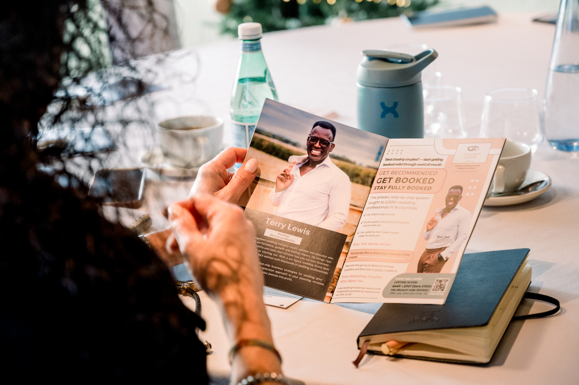 Attendee reading Wedcon brochure