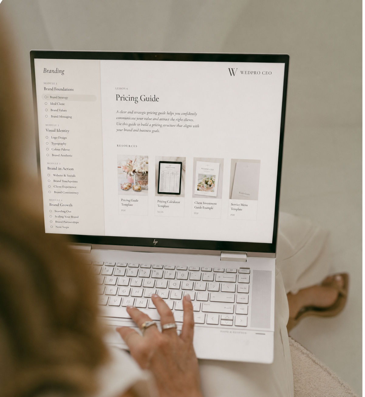 WedPro CEO course shown on a laptop — Branding module with Pricing Guide lesson