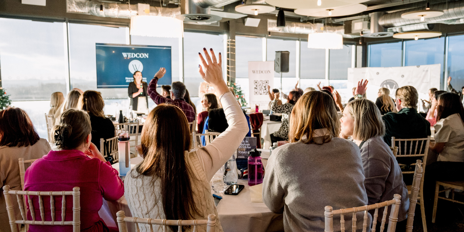 Audience engaged during keynote at Wedcon
